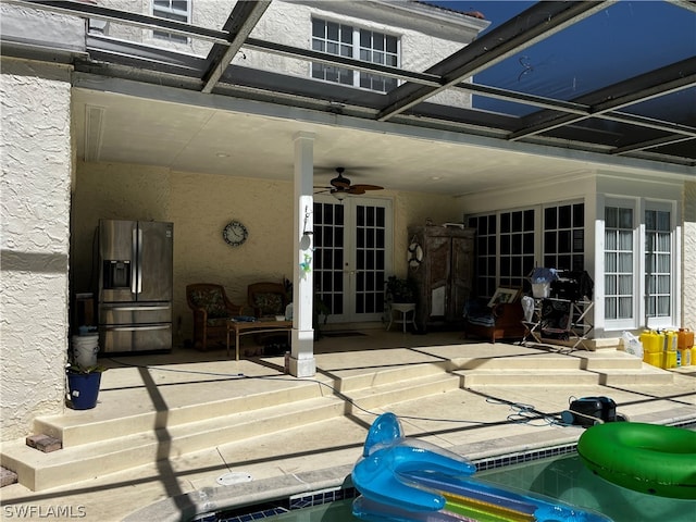 view of patio / terrace with ceiling fan and french doors