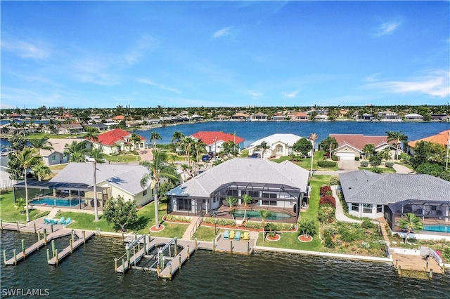 birds eye view of property featuring a water view