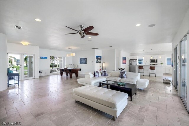 living room with ceiling fan, french doors, and billiards