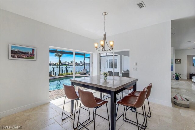 dining area featuring a notable chandelier