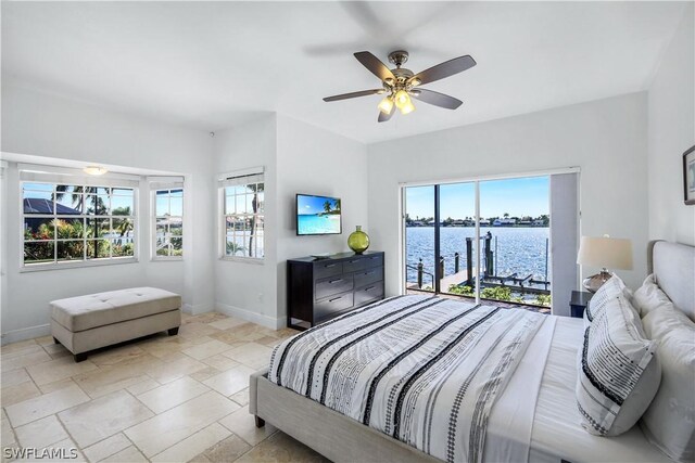 bedroom with multiple windows, access to outside, and ceiling fan