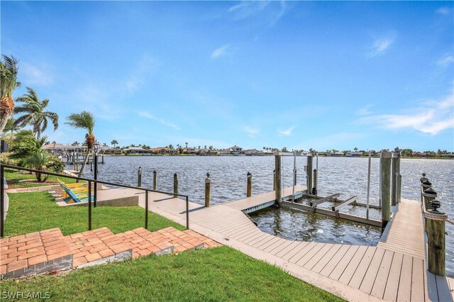 dock area featuring a yard and a water view