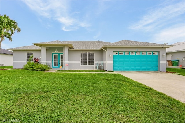 view of front facade with a garage and a front lawn