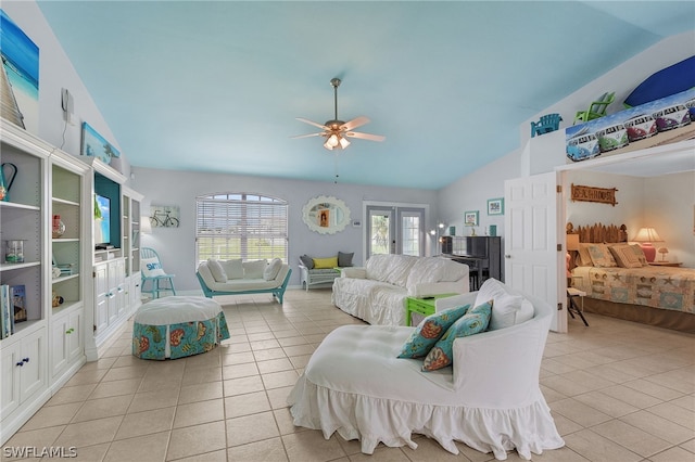 tiled living room with ceiling fan, lofted ceiling, a wealth of natural light, and french doors