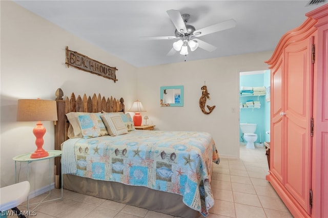 bedroom featuring ensuite bathroom, a walk in closet, ceiling fan, light tile patterned flooring, and a closet