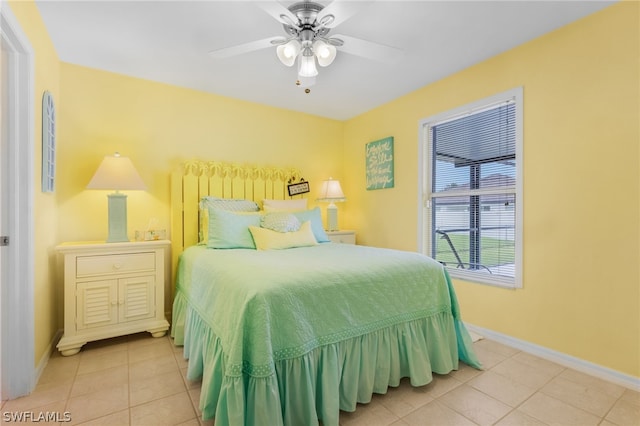 bedroom with tile patterned floors and ceiling fan