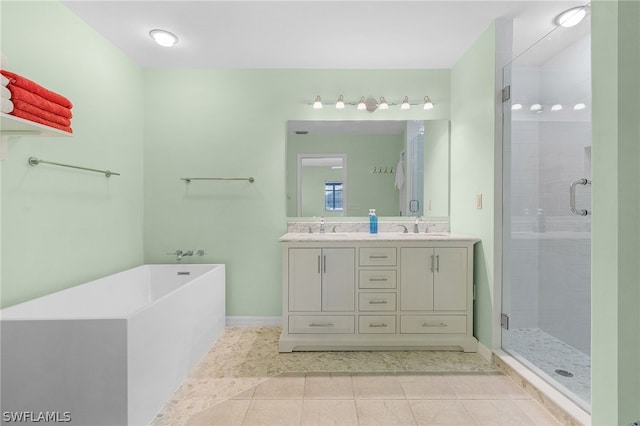 bathroom with shower with separate bathtub, vanity, and tile patterned floors