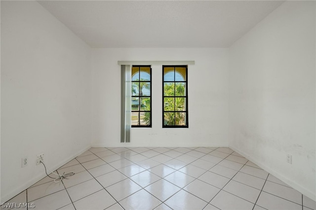 empty room with light tile patterned flooring