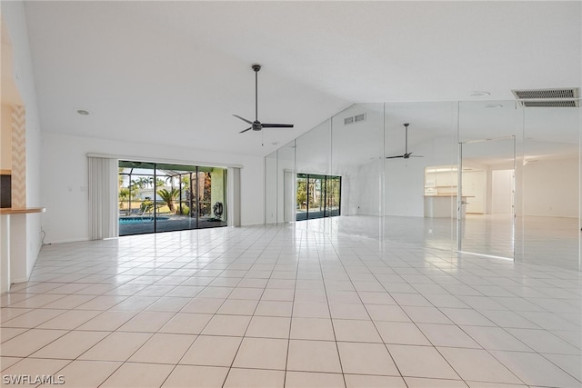 spare room with ceiling fan, light tile patterned floors, and high vaulted ceiling