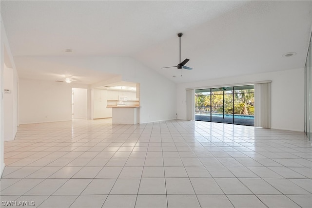 tiled spare room featuring ceiling fan and lofted ceiling