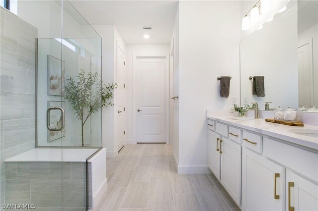 bathroom with vanity and an enclosed shower