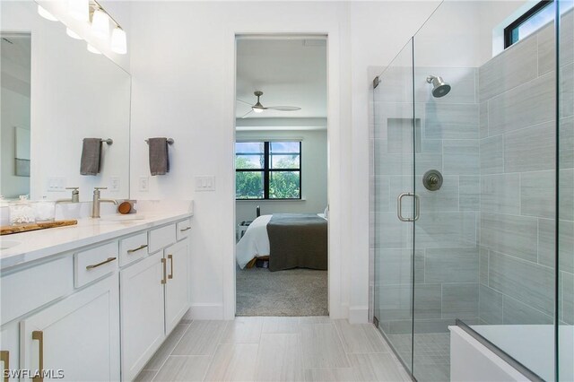 bathroom featuring vanity, tile patterned flooring, ceiling fan, and walk in shower