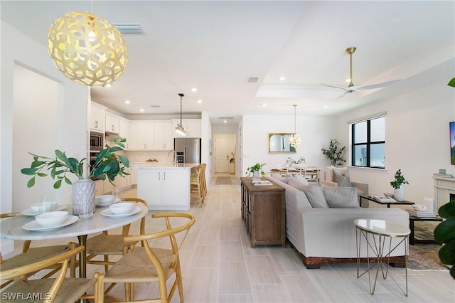 living room featuring recessed lighting, visible vents, and ceiling fan