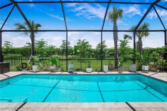 view of swimming pool with a lanai