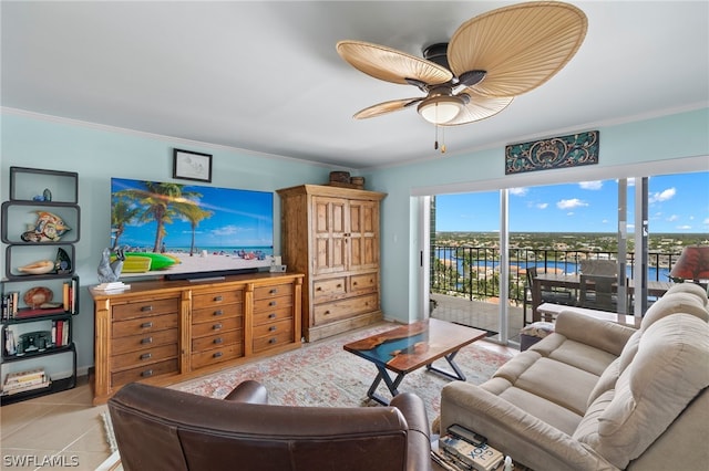 tiled living room featuring ceiling fan and ornamental molding