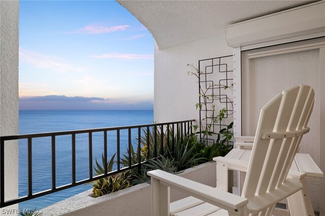 balcony at dusk with a water view