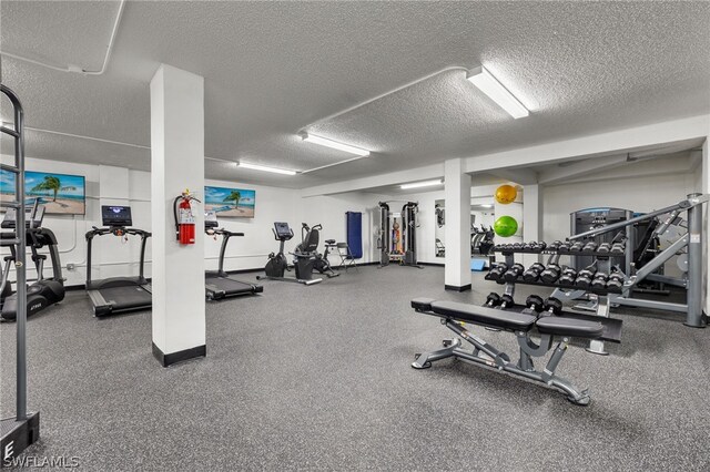 workout area with a textured ceiling