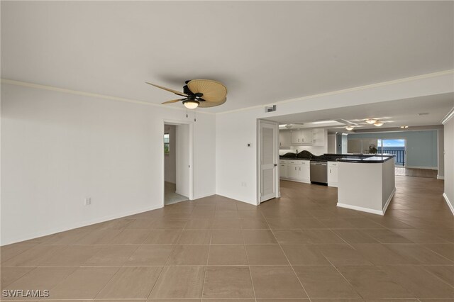 unfurnished living room with tile patterned floors, ceiling fan, and ornamental molding