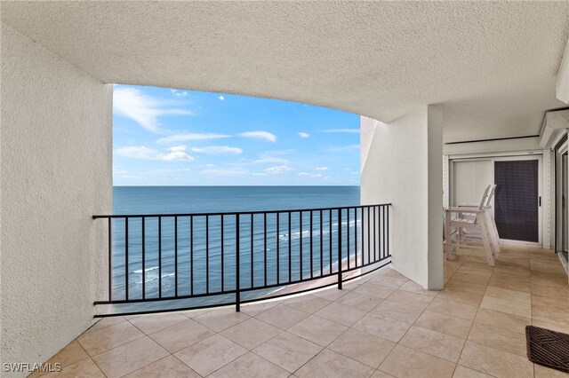 balcony featuring a water view