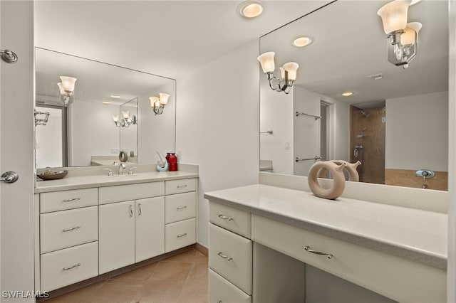 bathroom with vanity, tile patterned floors, and walk in shower