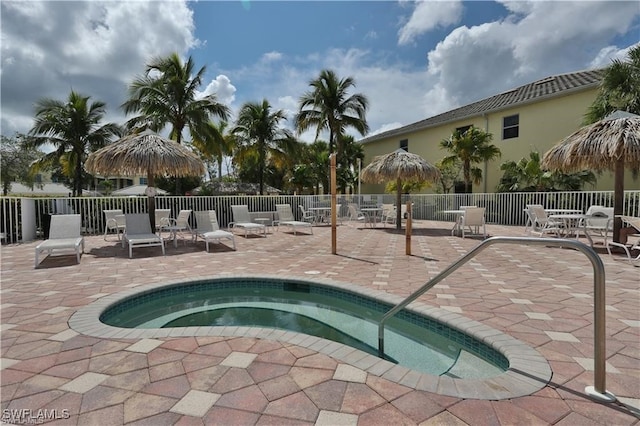 view of pool with a patio area and a community hot tub