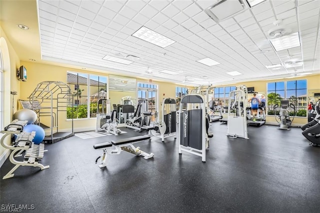 14573 Abaco Lakes Dr Unit 102, Fort Myers, FL 33908 - workout area featuring plenty of natural light and a paneled ceiling