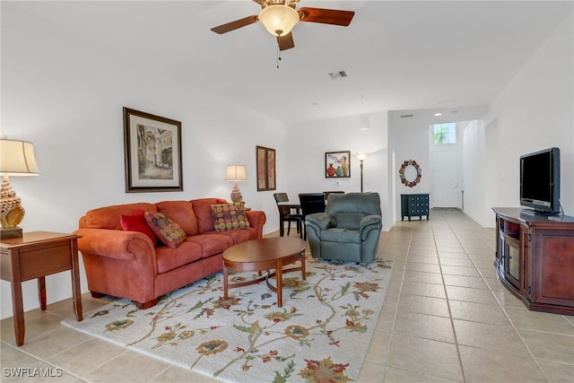 tiled living room with ceiling fan