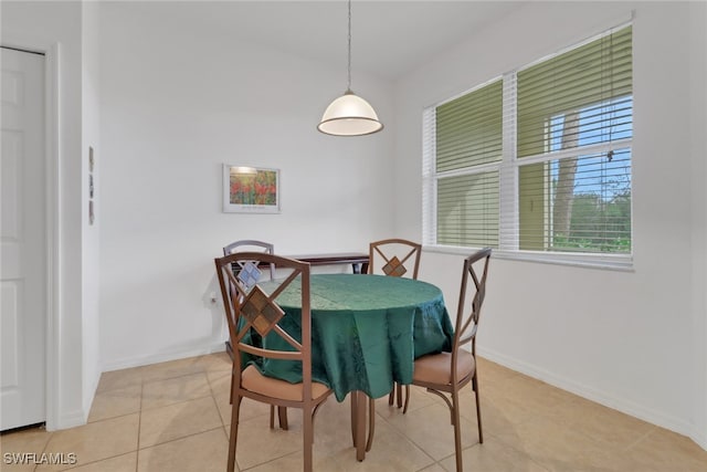 dining space featuring light tile patterned flooring