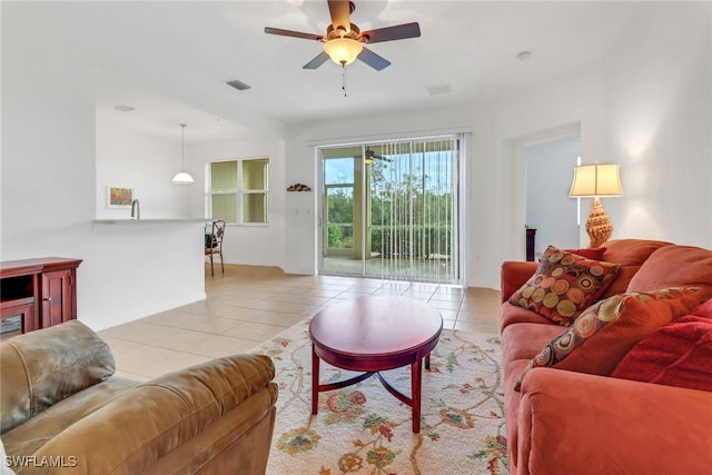 living room with ceiling fan and light tile patterned floors