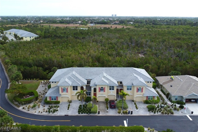 14573 Abaco Lakes Dr Unit 102, Fort Myers, FL 33908 - view of subject property featuring a forest