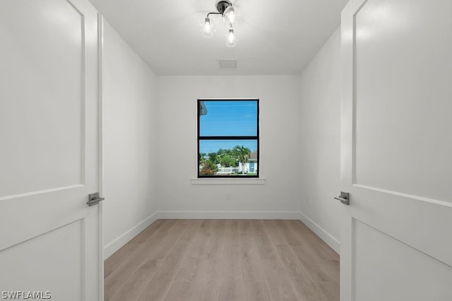 unfurnished room featuring light hardwood / wood-style floors