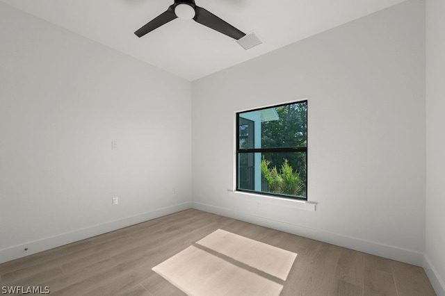 spare room featuring ceiling fan and light wood-type flooring