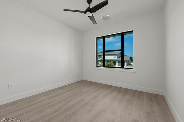 unfurnished room featuring ceiling fan and light hardwood / wood-style flooring