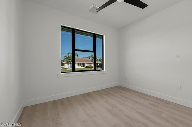 empty room featuring ceiling fan and light wood-type flooring