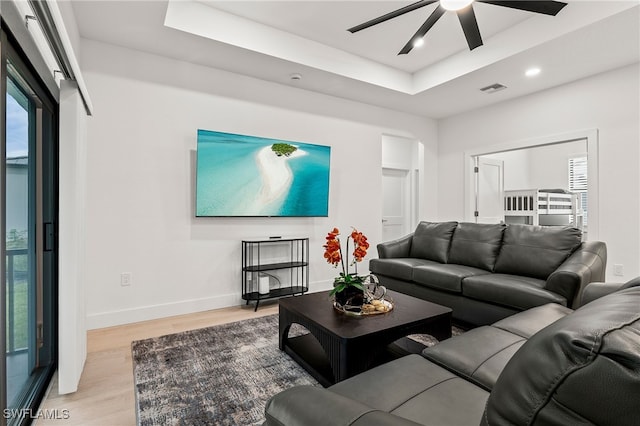 27071 Holly Ln, Bonita Springs, FL 34135 - living room featuring recessed lighting, visible vents, baseboards, light wood-type flooring, and a raised ceiling