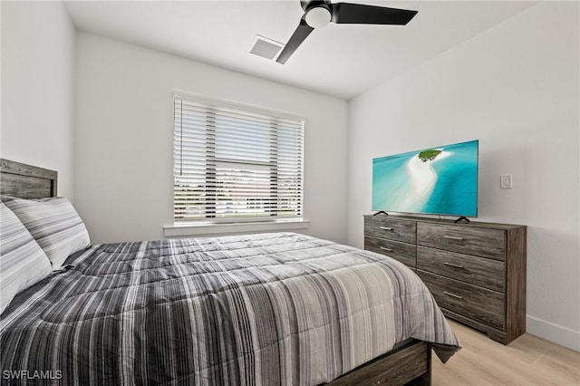 27071 Holly Ln, Bonita Springs, FL 34135 - bedroom featuring baseboards, light wood finished floors, visible vents, and a ceiling fan