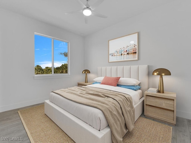 bedroom with hardwood / wood-style flooring and ceiling fan