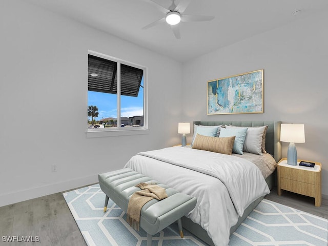 bedroom featuring light hardwood / wood-style flooring and ceiling fan