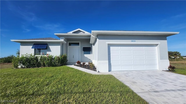 ranch-style house featuring a garage and a front lawn