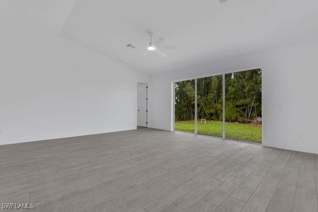 4728 NW 39th Pl, Cape Coral, FL 33993 - spare room featuring light wood-type flooring, a ceiling fan, and vaulted ceiling