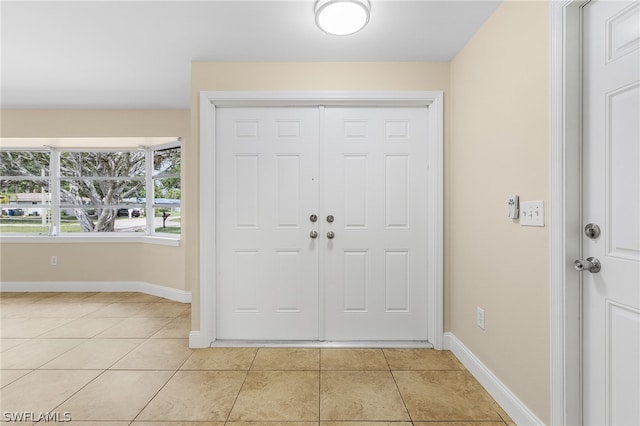 foyer with light tile floors