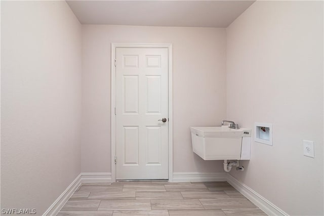 clothes washing area featuring sink and hookup for a washing machine