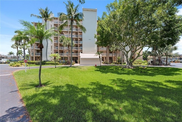 view of home's community featuring a lawn