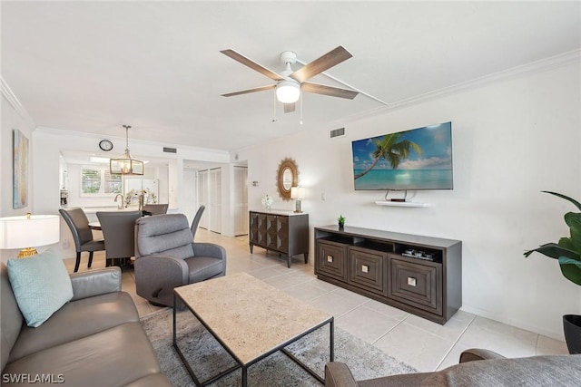 living room featuring light tile patterned floors, ceiling fan, and crown molding