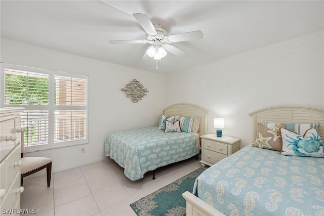 bedroom featuring light tile patterned floors and ceiling fan