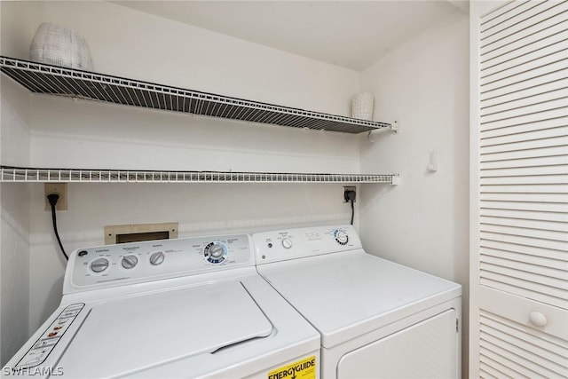 washroom featuring washer and clothes dryer