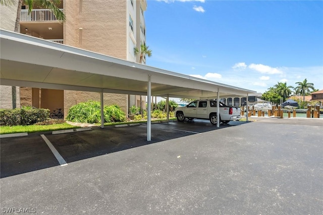 view of parking / parking lot with a carport