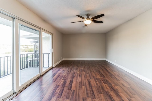 251 Palm Dr Unit 251-2, Naples, FL 34112 - empty room featuring dark wood-style flooring, baseboards, and ceiling fan