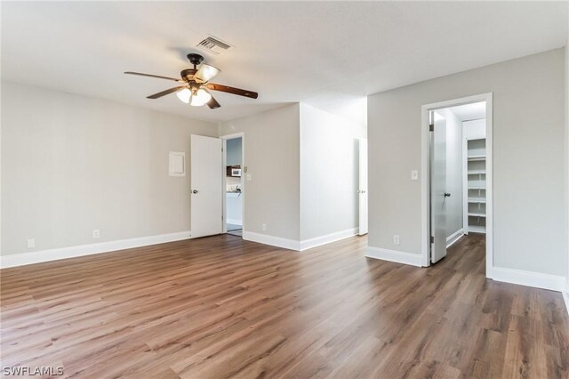 251 Palm Dr Unit 251-2, Naples, FL 34112 - unfurnished room featuring a ceiling fan, wood finished floors, and baseboards