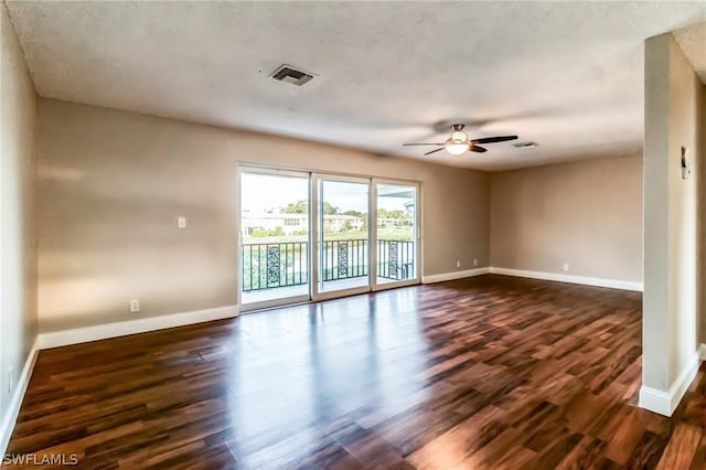 251 Palm Dr Unit 251-2, Naples, FL 34112 - unfurnished room with dark wood-style flooring, a ceiling fan, and baseboards